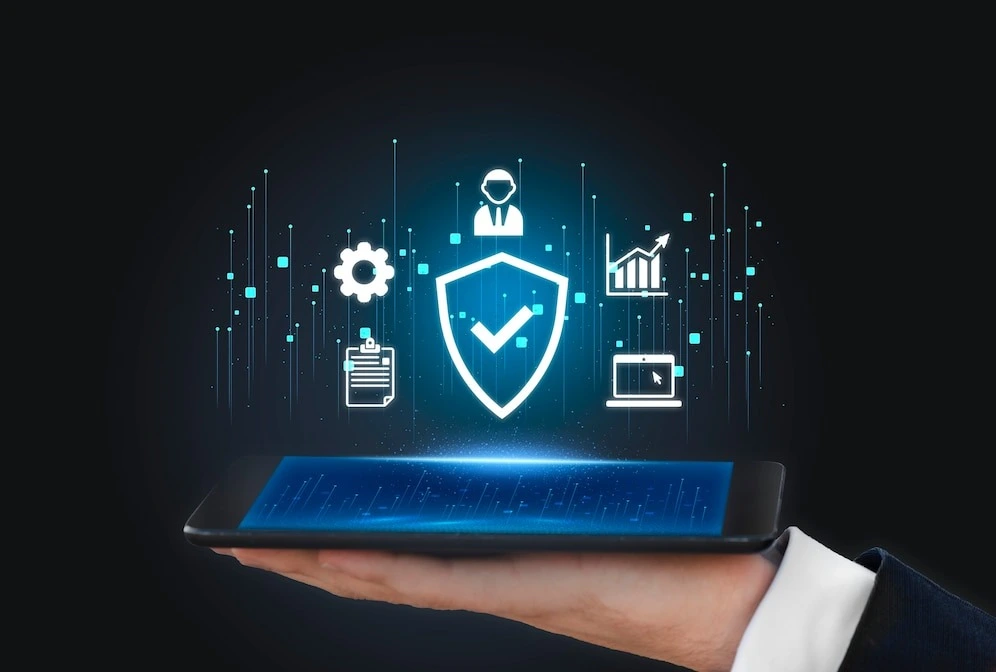 Hand holding a tablet projecting a holographic image of digital security and data management icons, symbolizing concepts related to cybersecurity and VPNs